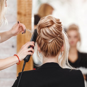Woman getting hair done